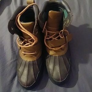 Polo boots. very lightly worn. Strap and buckle.